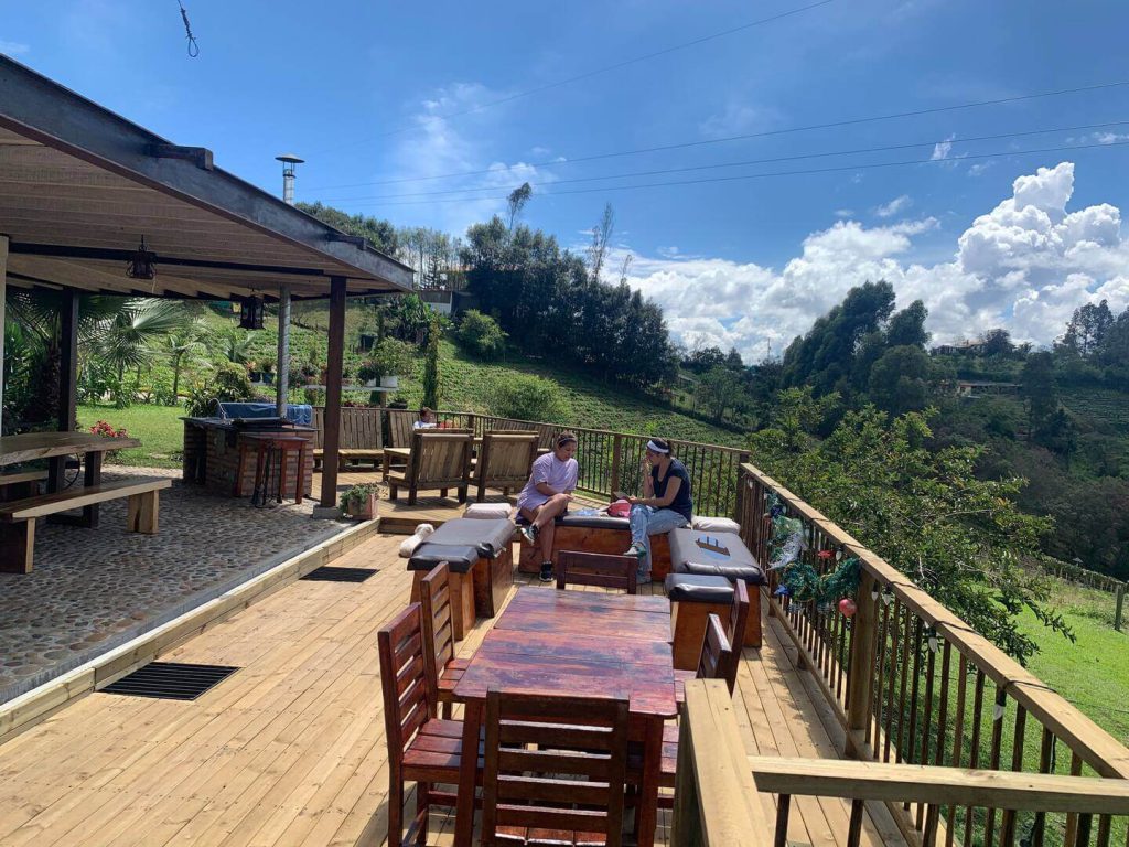 Large outdoor deck with shaded area for family reunions and bbq's at the finca in Rionegro